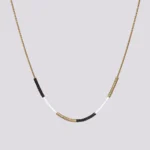 Simplicity ogrlica zlatna crna bela